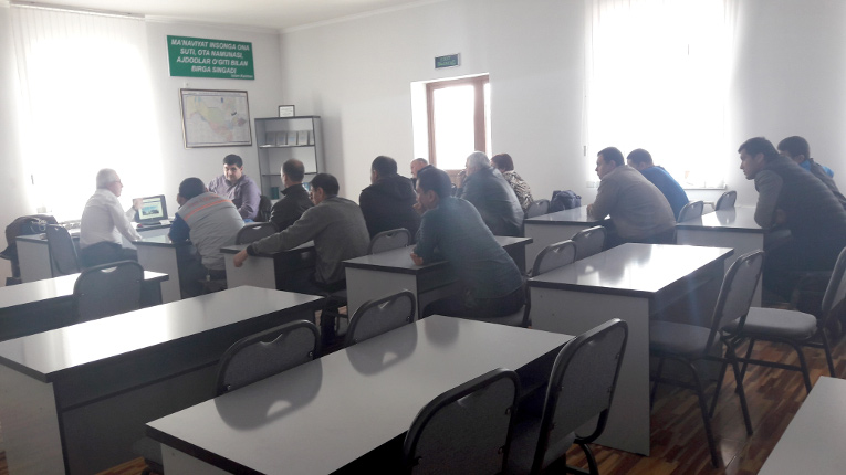 Victor Kiryukhin (L) is giving a seminar for the technical specialists of Uzbekenergo