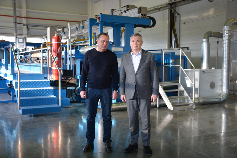 Vladimir Pastushenko (L) and Alexander Slavinsky at the insulation making shop of Izolyator