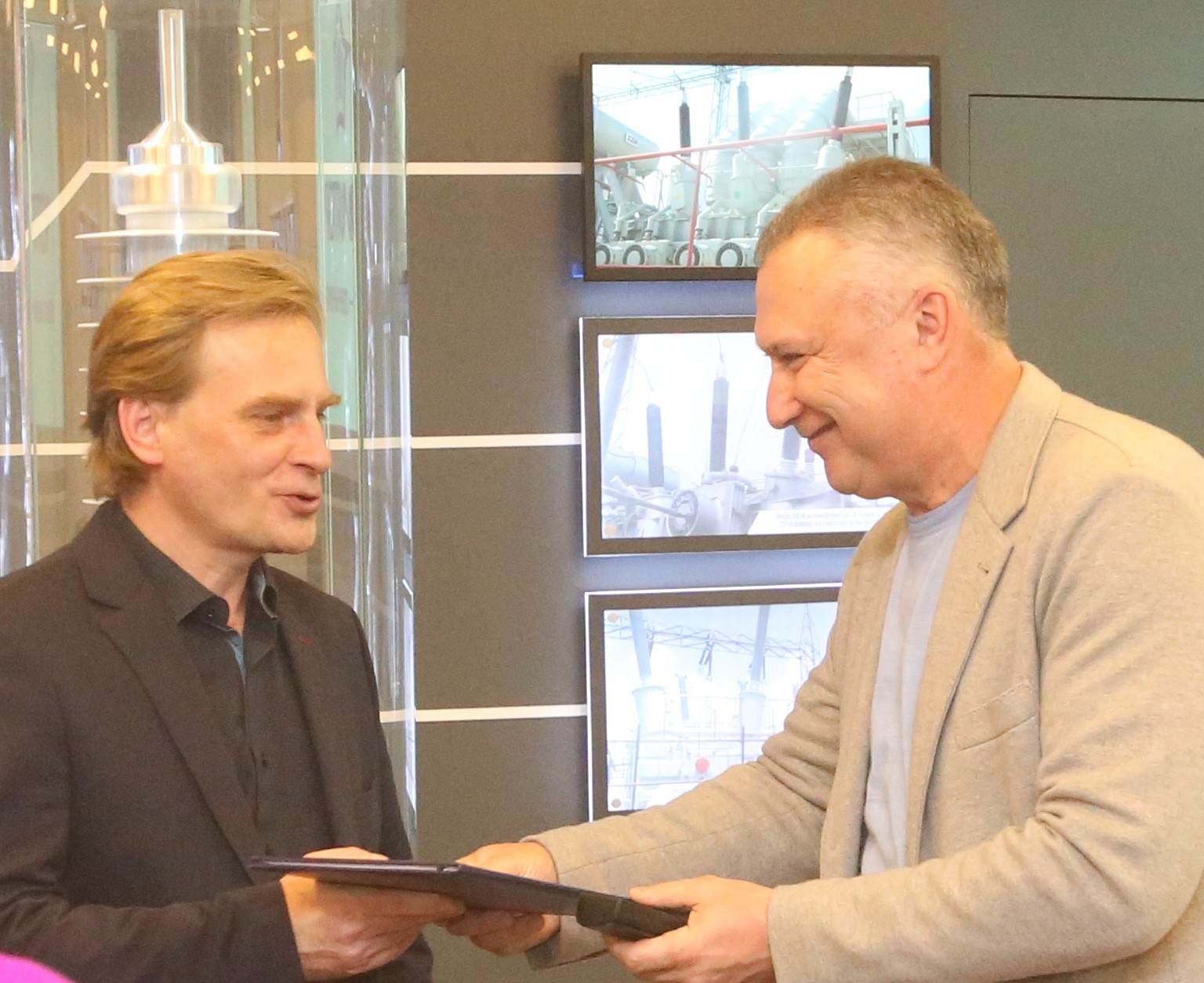 Director of sports center of the National Research University of Electronic Technology Konstantin Firsanov (L) and Alexander Slavinsky at the meeting at Izolyator plant